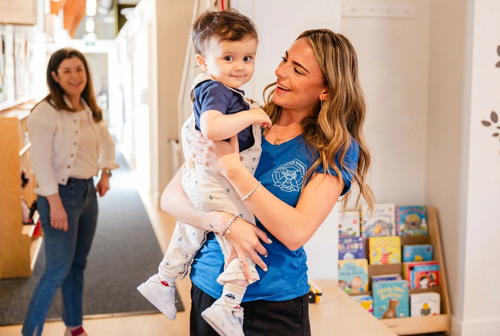 Educators building relationships with children at The Little Campus